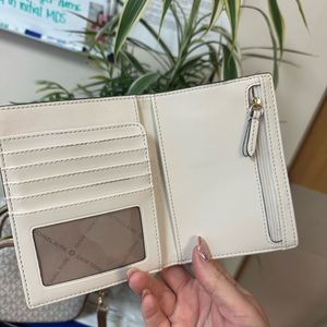 Authentic Michael Kors crossbody and matching wallet. Like new